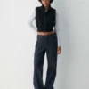 chaleco sin mangas con cuello alto Polartec® Thermal Pro™. chaleco sin mangas con cuello alto Polartec® Thermal Pro™.