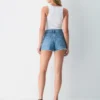 Denim Forum Jodie Mini short vaquero de talle alto y corte curvilíneo Denim Forum Jodie Mini short vaquero de talle alto y corte curvilíneo